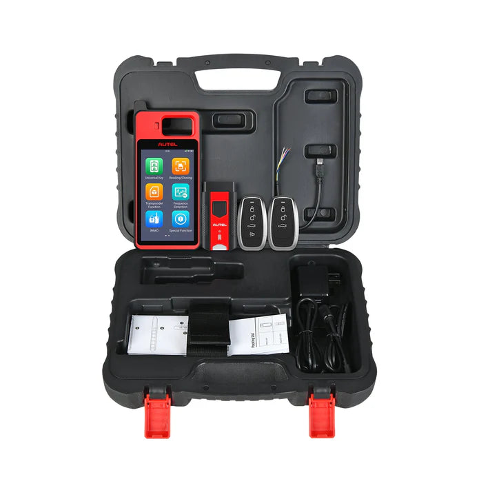 Contenido completo del kit Autel MaxiIM KM100 en su maletín rígido negro, incluyendo la unidad principal, el VCI V200 y dos llaves inteligentes.