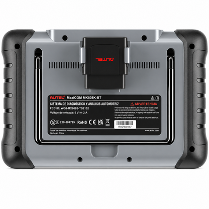 Vista trasera de la máquina de diagnosis Autel MaxiCOM MK808K-BT, mostrando el soporte metálico desplegable y el compartimento de anclaje diseñado para guardar de forma segura el módulo inalámbrico MaxiVCI Mini.